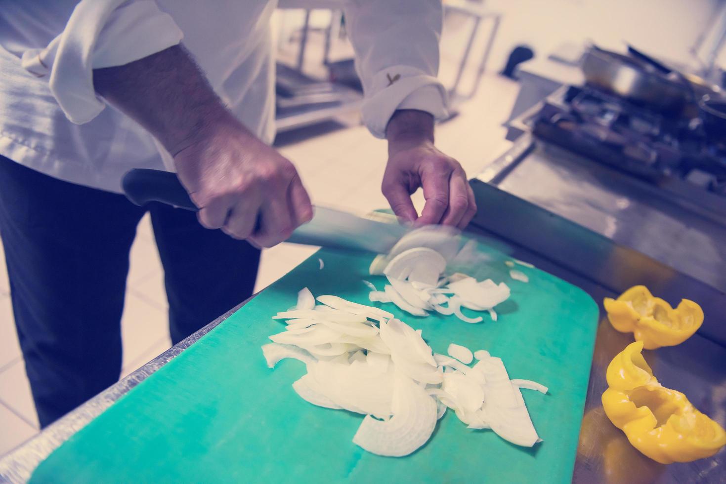 Chef hands cutting fresh and delicious vegetables photo