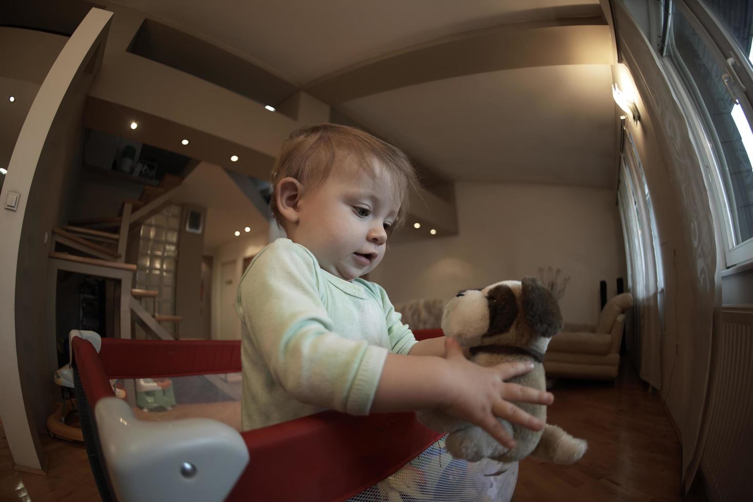 cute  little  baby playing in mobile  bed photo