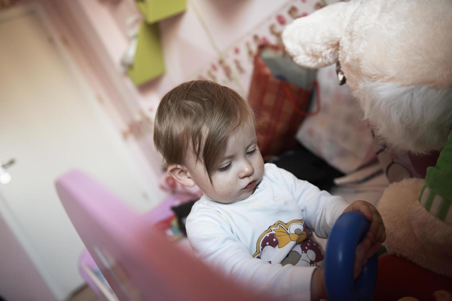 cute  little one year old baby and making first steps photo