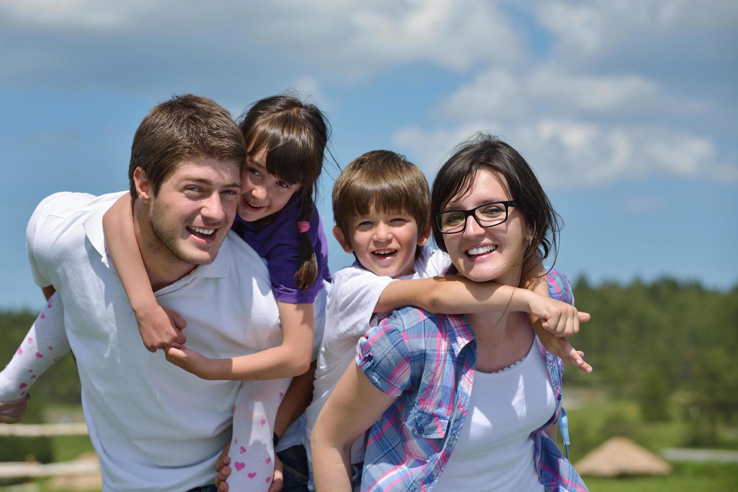 happy young family have fun outdoors photo