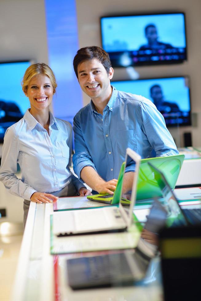 People in electronics store photo