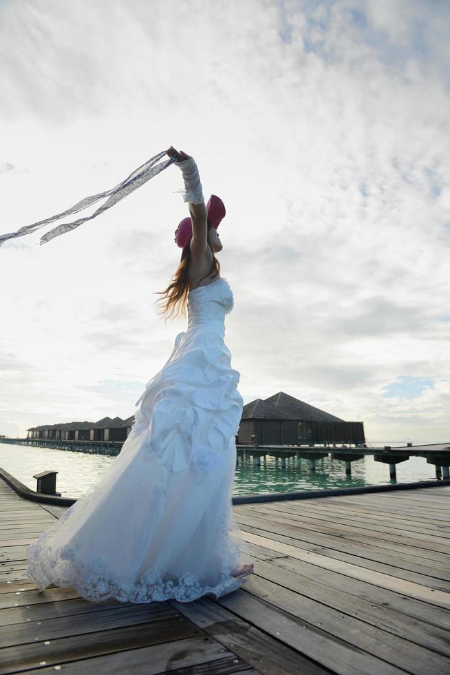 asian bride on beach photo