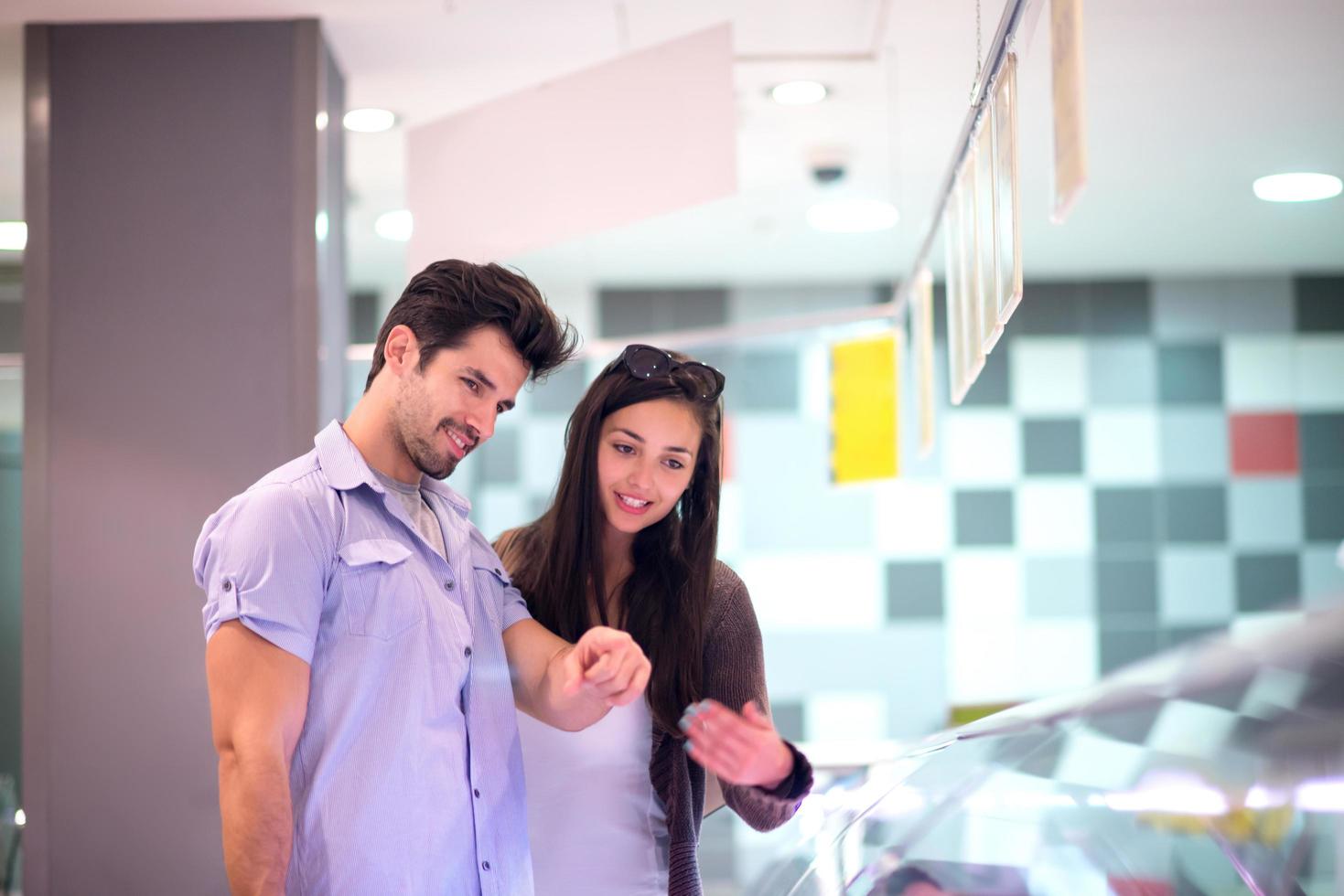 couple shopping in a supermarket photo