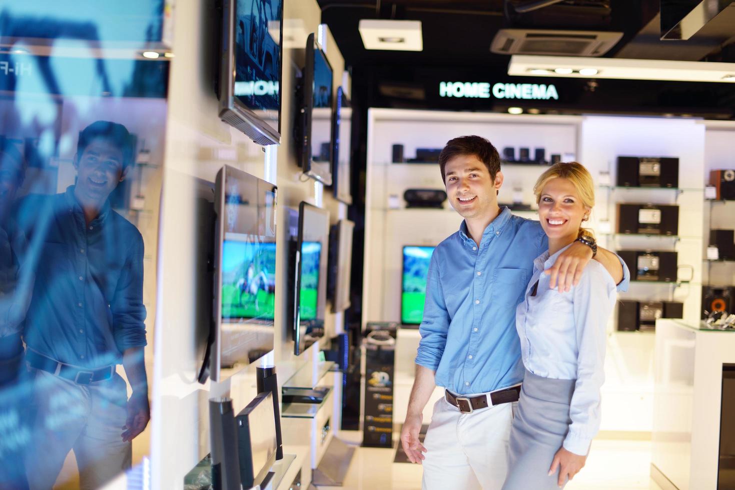 People in electronics store photo