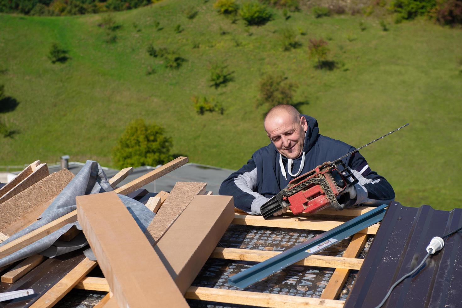 Construction worker installing a new roof photo