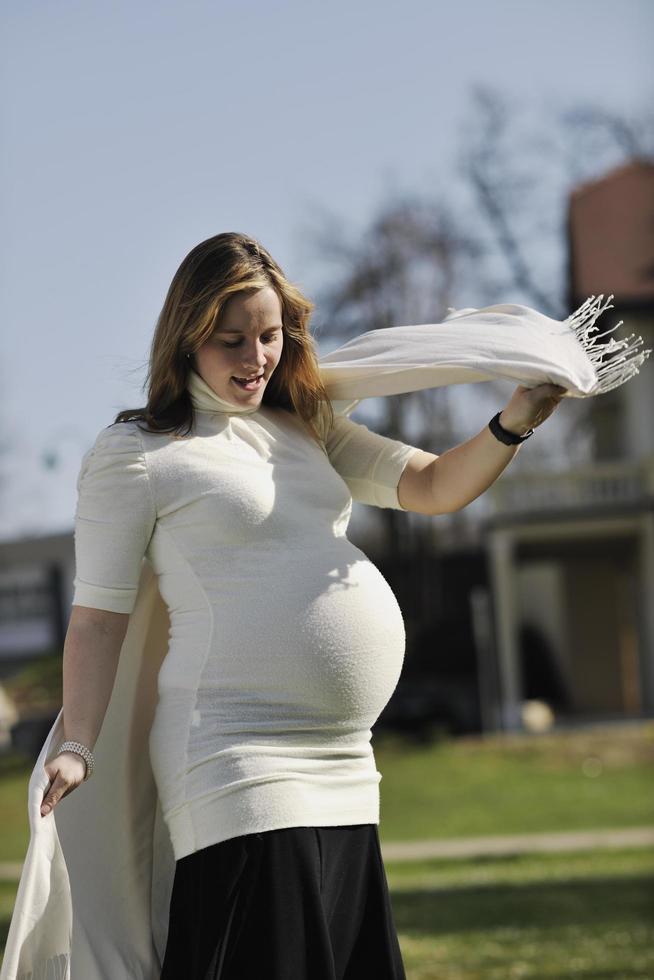 happy young pregnant woman outdoor photo