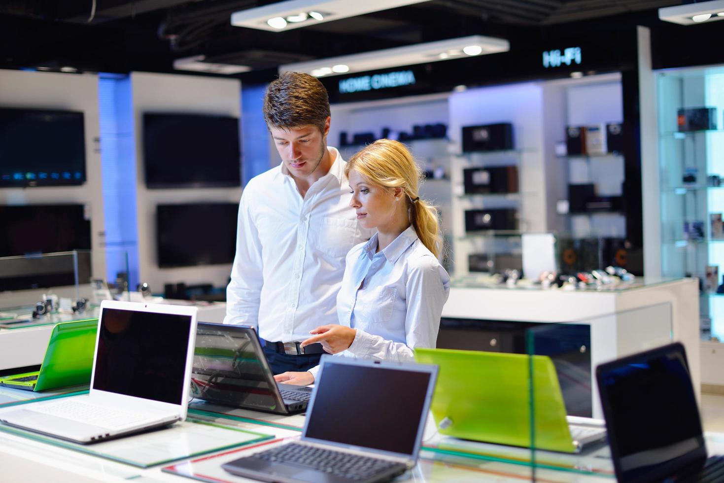 People in electronics store photo