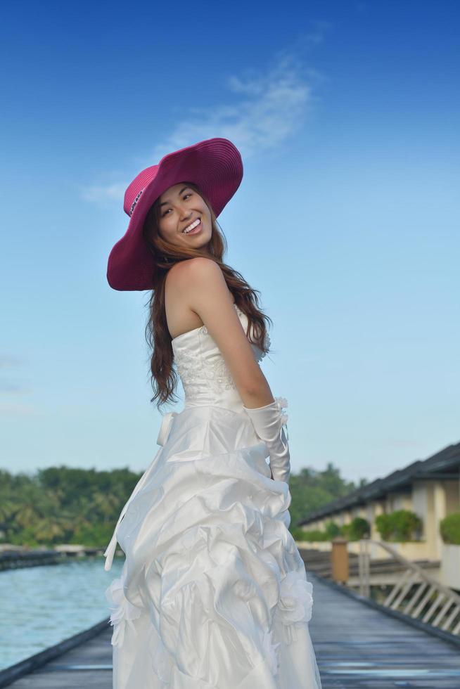 asian bride on beach photo