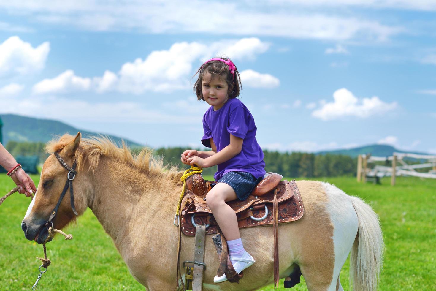 child ride pony photo