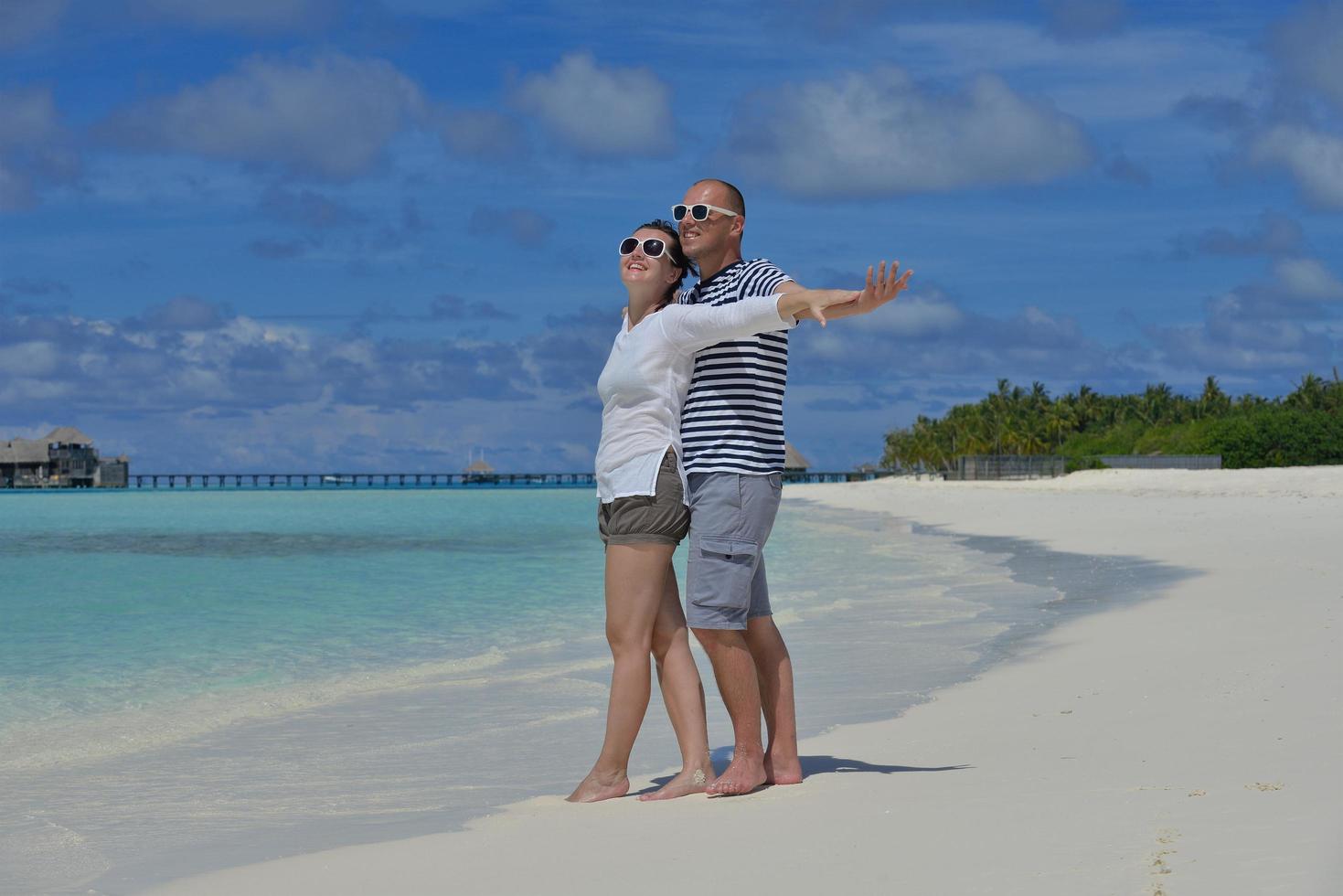 happy young  couple at summer vacation have fun and relax at beach photo