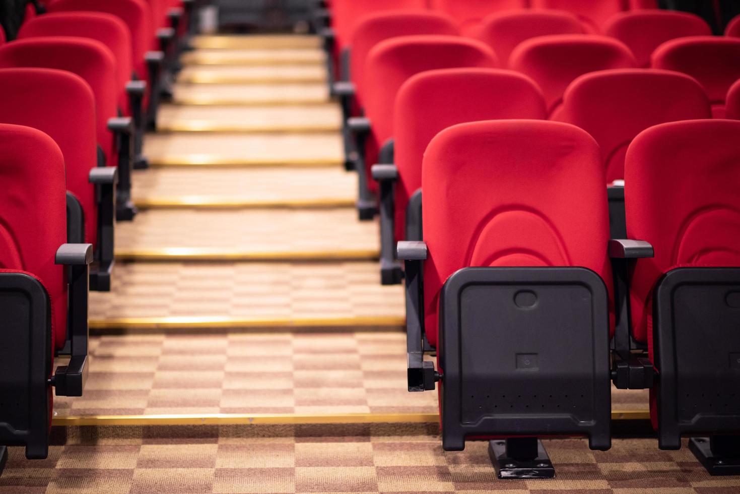 hall with rows of red seats photo