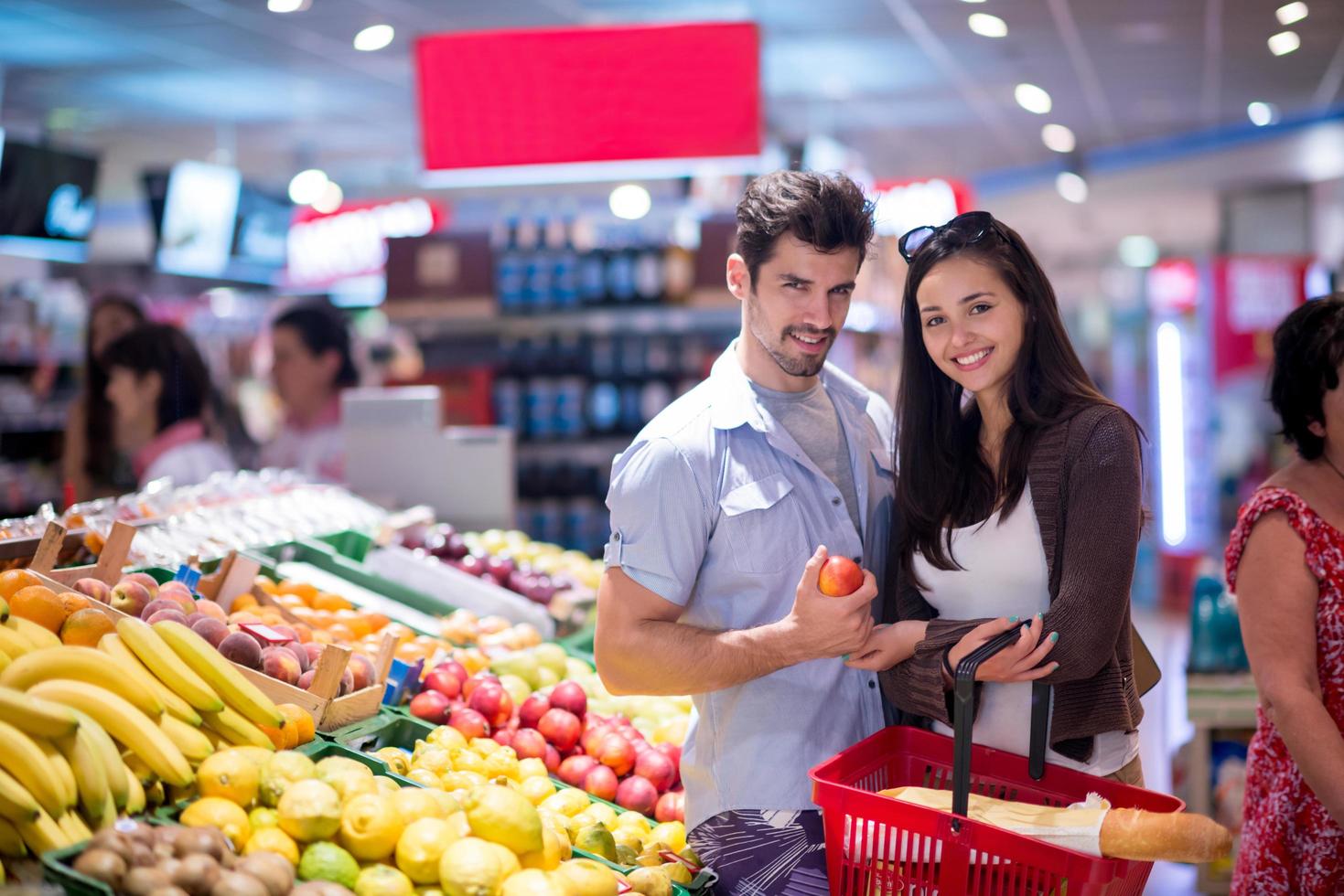 couple shopping in a supermarket photo