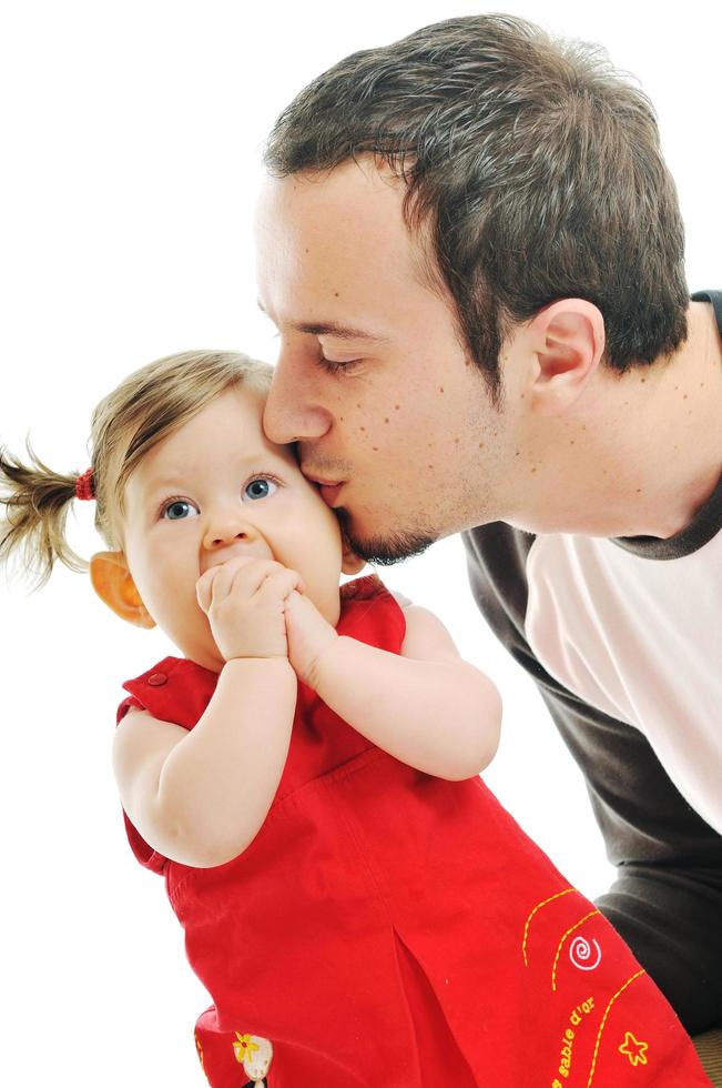 joven padre juega con una hermosa hija foto