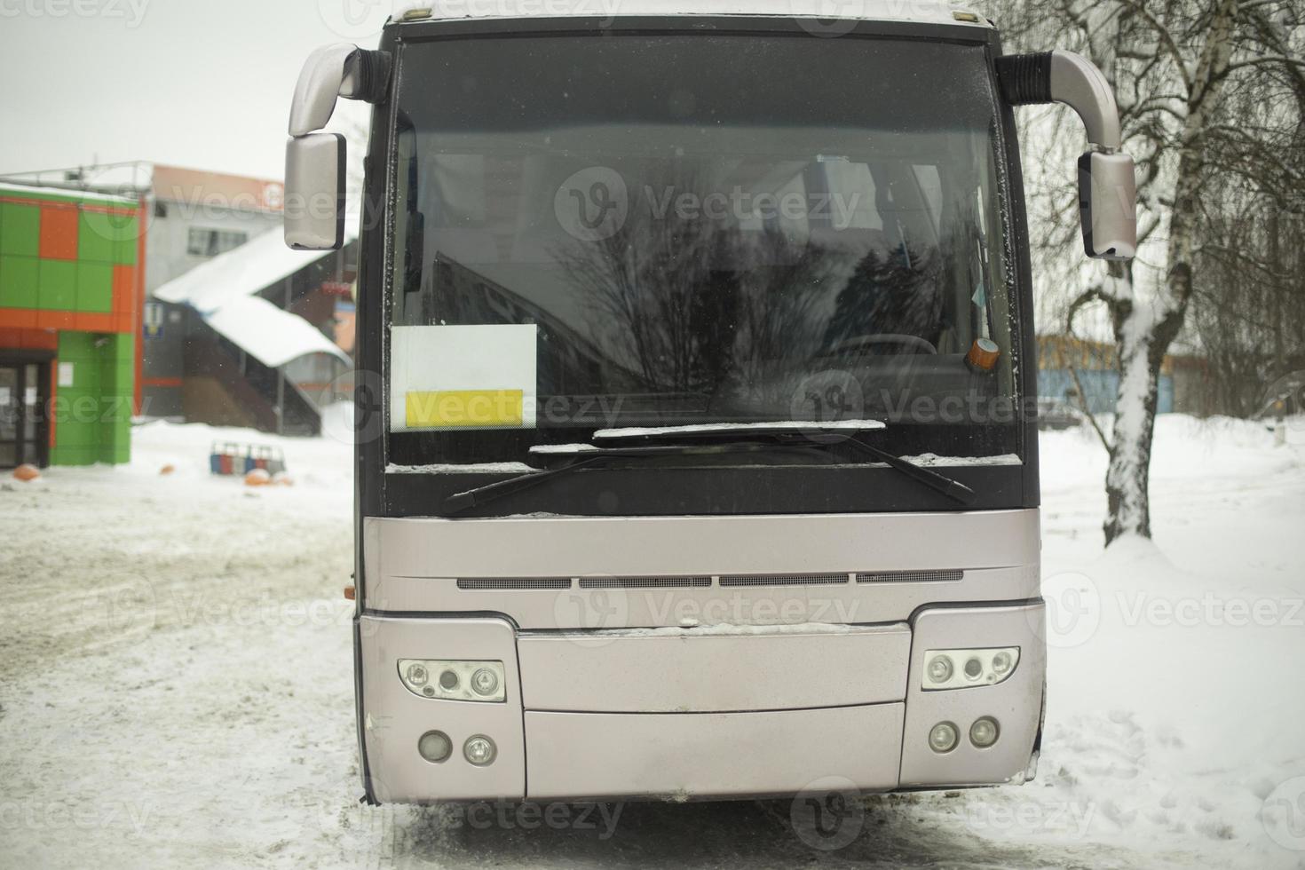 Bus in parking lot. Transport in winter. Public transport in city. photo