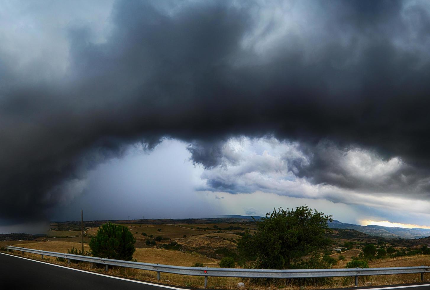 Threatening skies.
Rain clouds and black sky textured background. Thunderstorm cloud danger.
  Black cloud and thunderstorm, dark sky and motion clouds with rain.
Storm clouds, amazing shelf cloud, sunset storm. photo