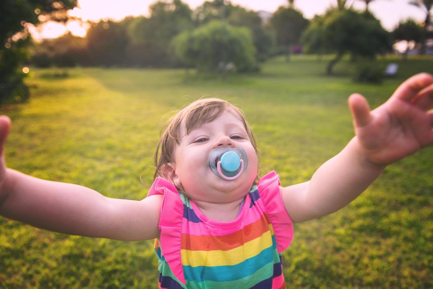 little girl spending time at backyard photo