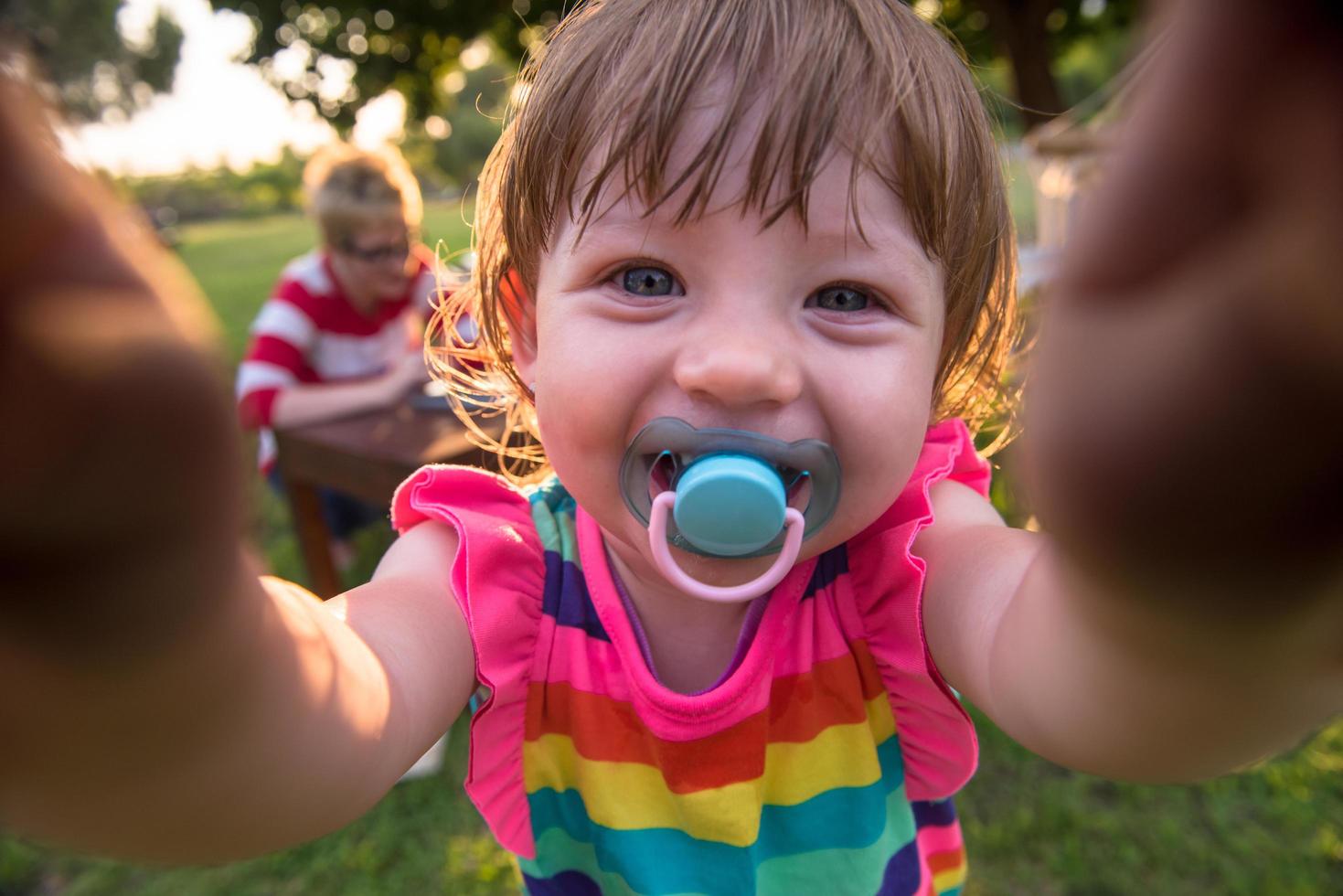 little girl spending time at backyard photo