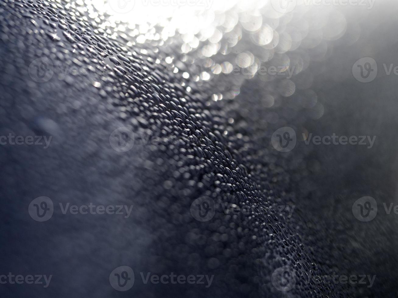 dew water drops on blue metallic surface photo