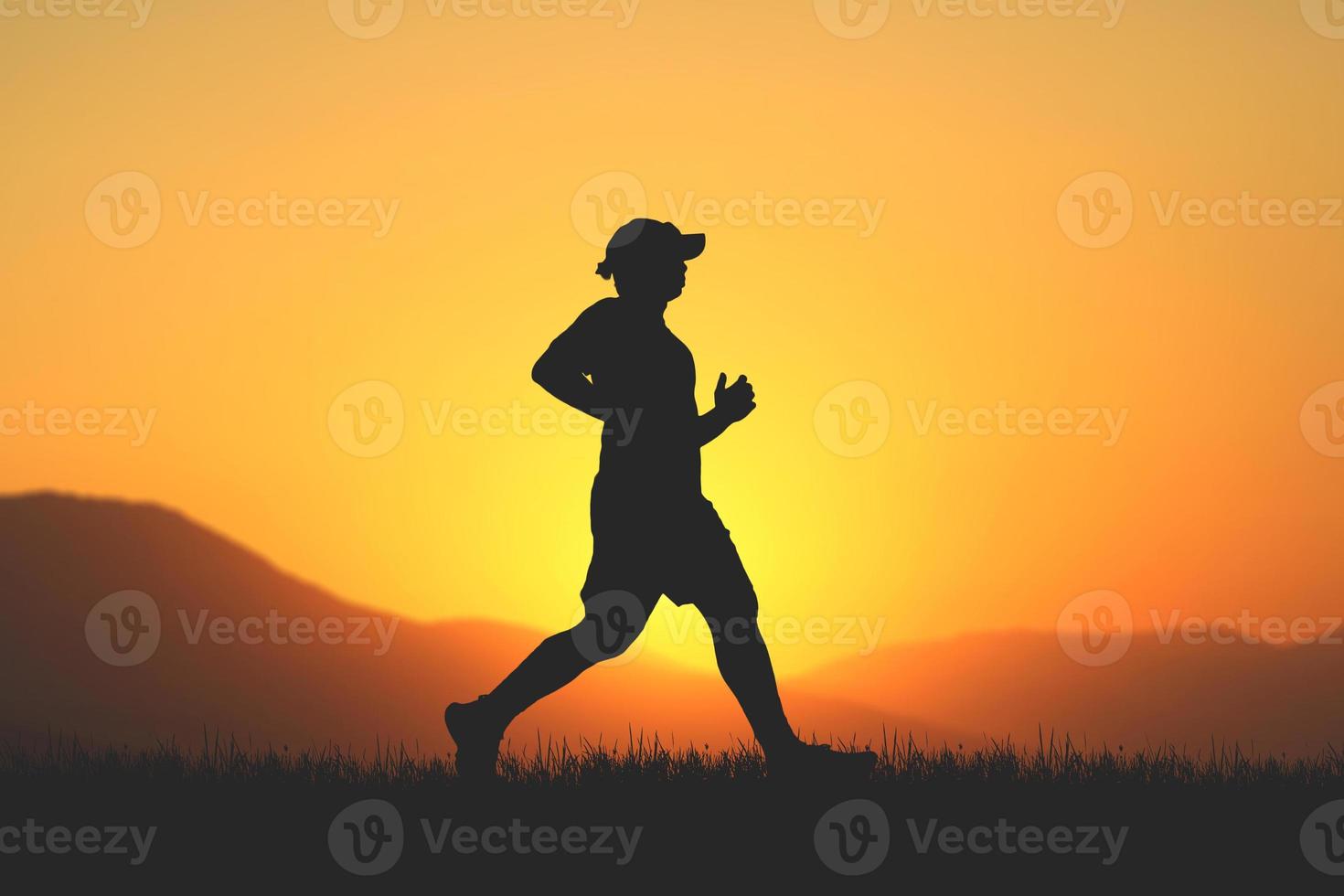 men's silhouette I am jogging to stay healthy in the evening. Men exercise by running. health care concept photo