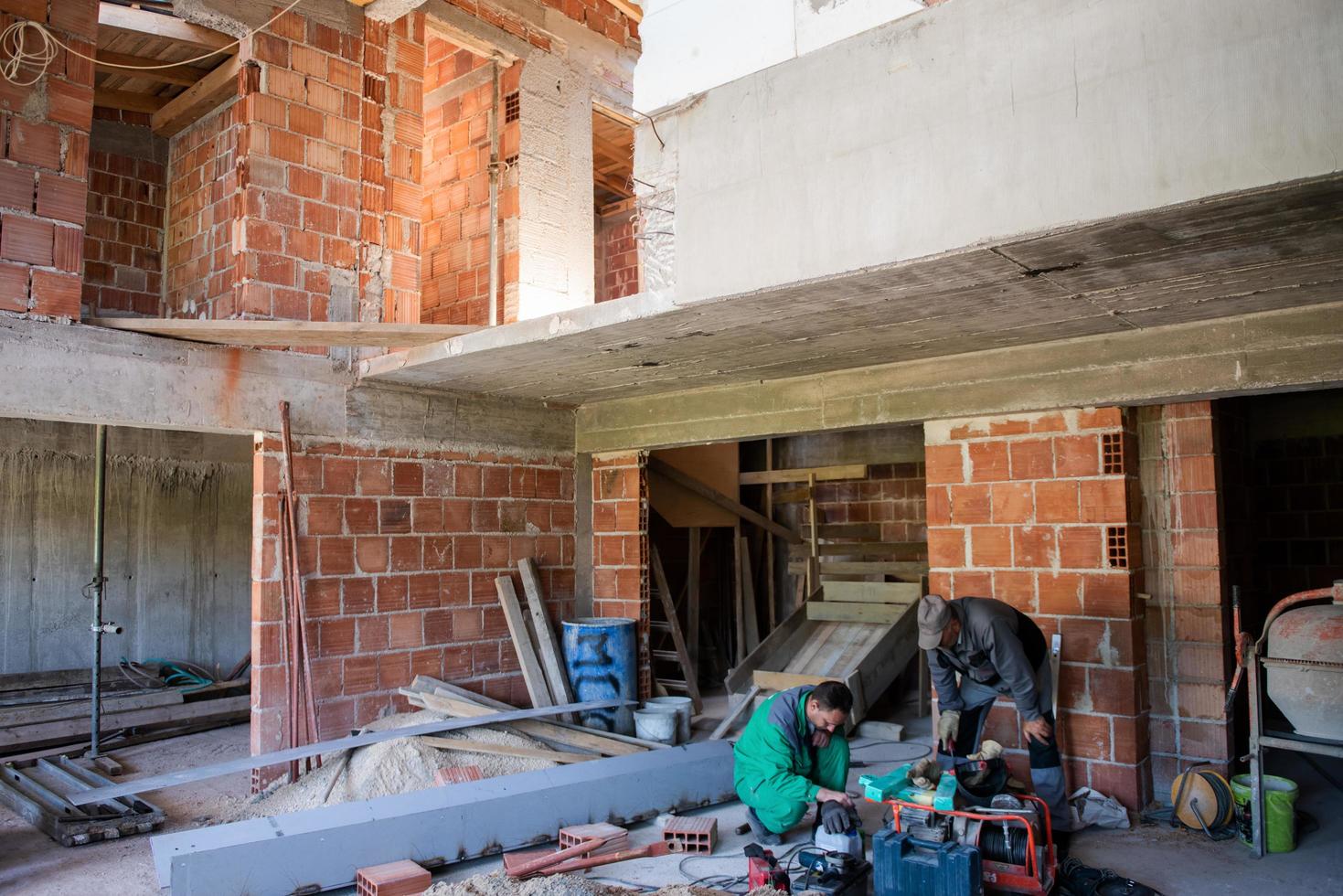 workers on interior of construction site photo