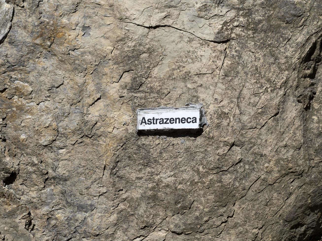 RECCO, ITALY - APRIL 26 2021 - Astrazeneca Vaccine name on stone behind the church photo