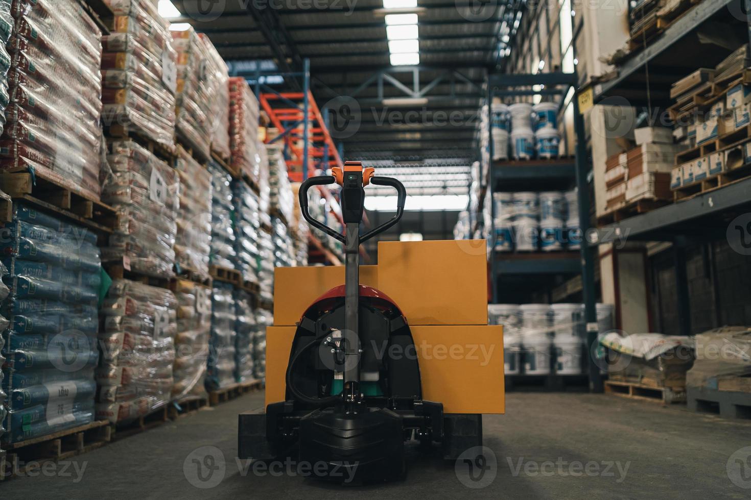 Forklifts for transporting goods in industrial warehouse storage of retail shop. Warehouse interior with shelves rack for keep production material, pallets and boxes. Industrial concept. photo