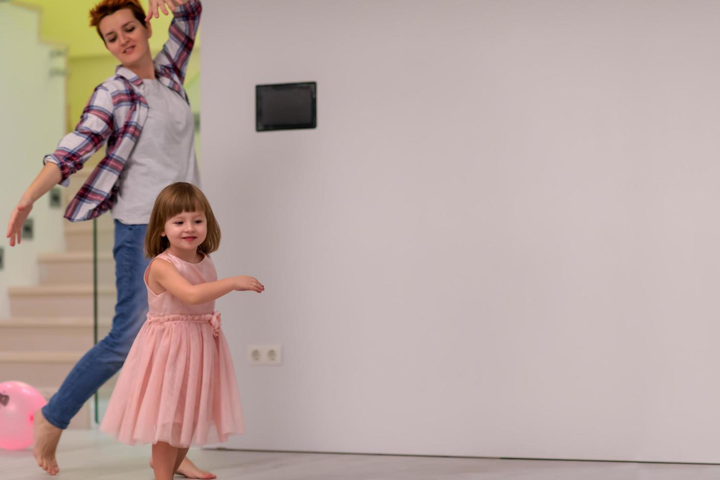 mom and little daughter spending time together at home photo