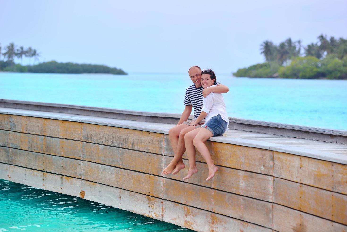 happy young couple have fun on beach photo