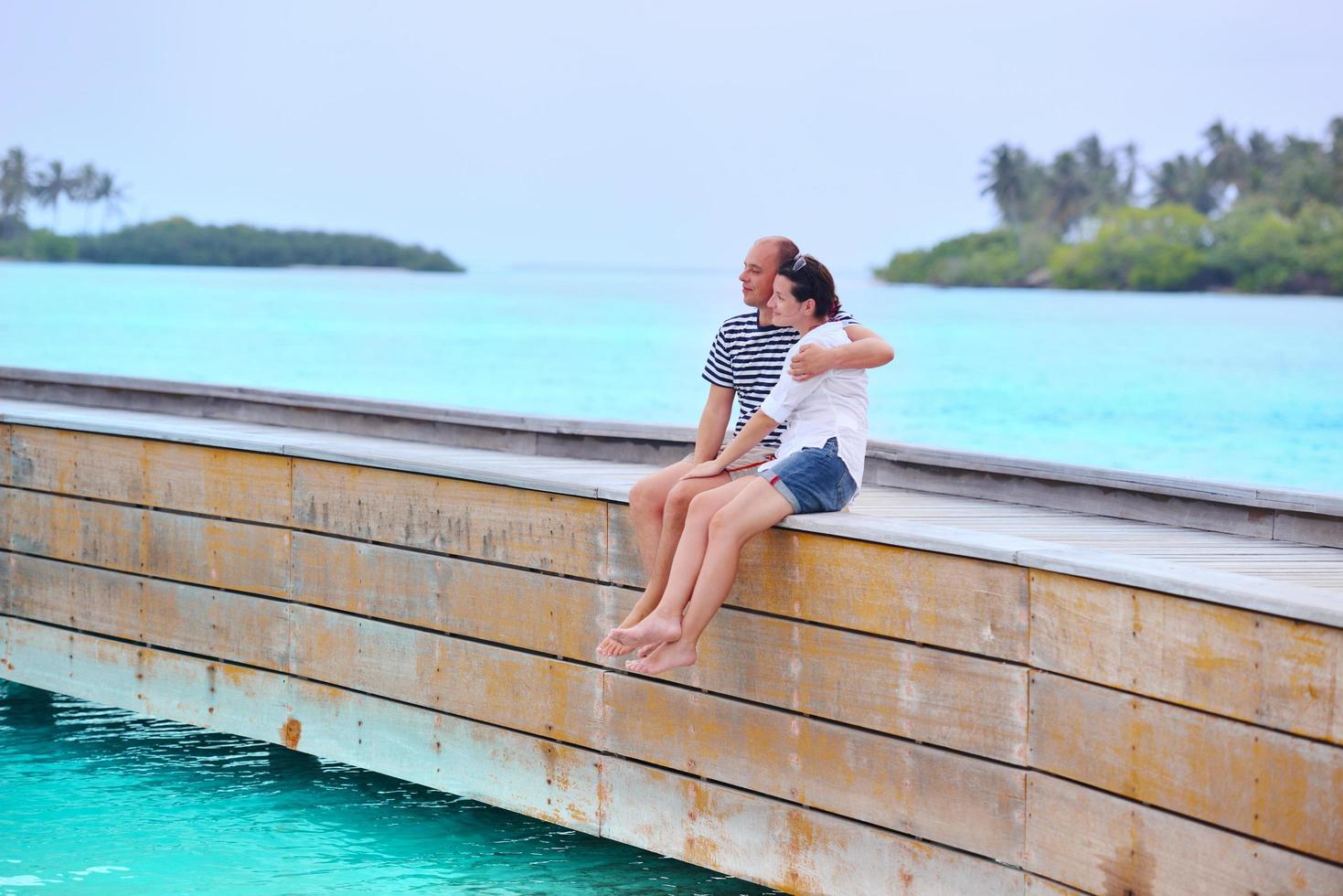 happy young couple have fun on beach photo