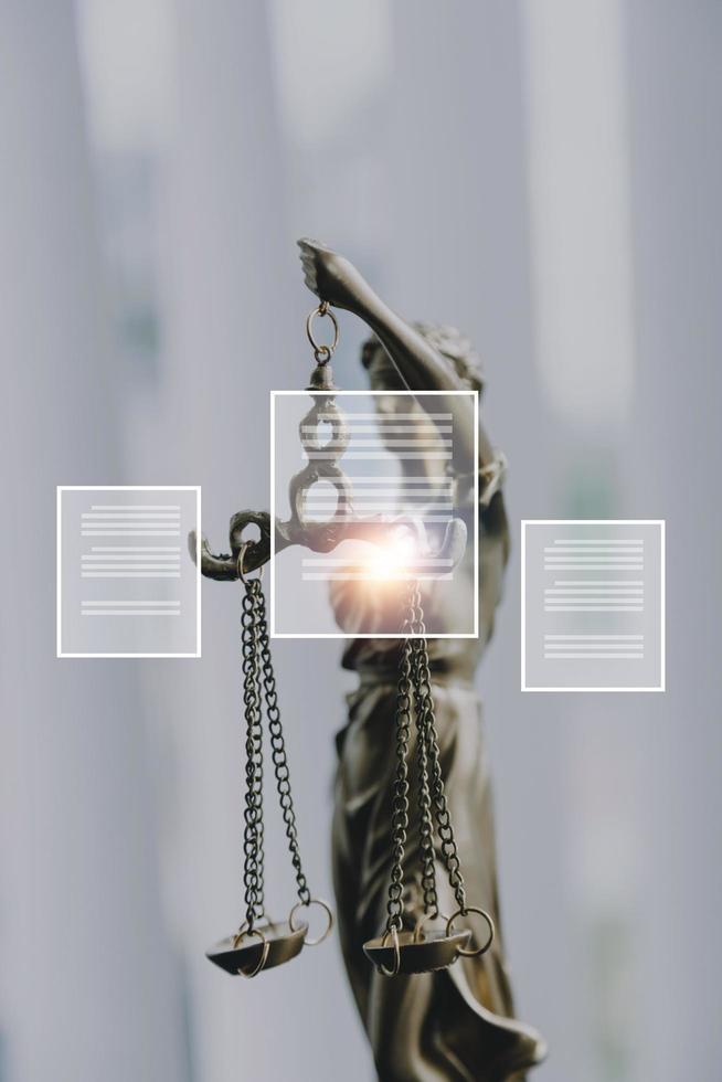 Justice and law concept.Male judge in a courtroom with the gavel, working with, computer and docking keyboard, eyeglasses, on table in morning light photo