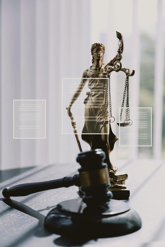 Justice and law concept.Male judge in a courtroom with the gavel, working with, computer and docking keyboard, eyeglasses, on table in morning light photo