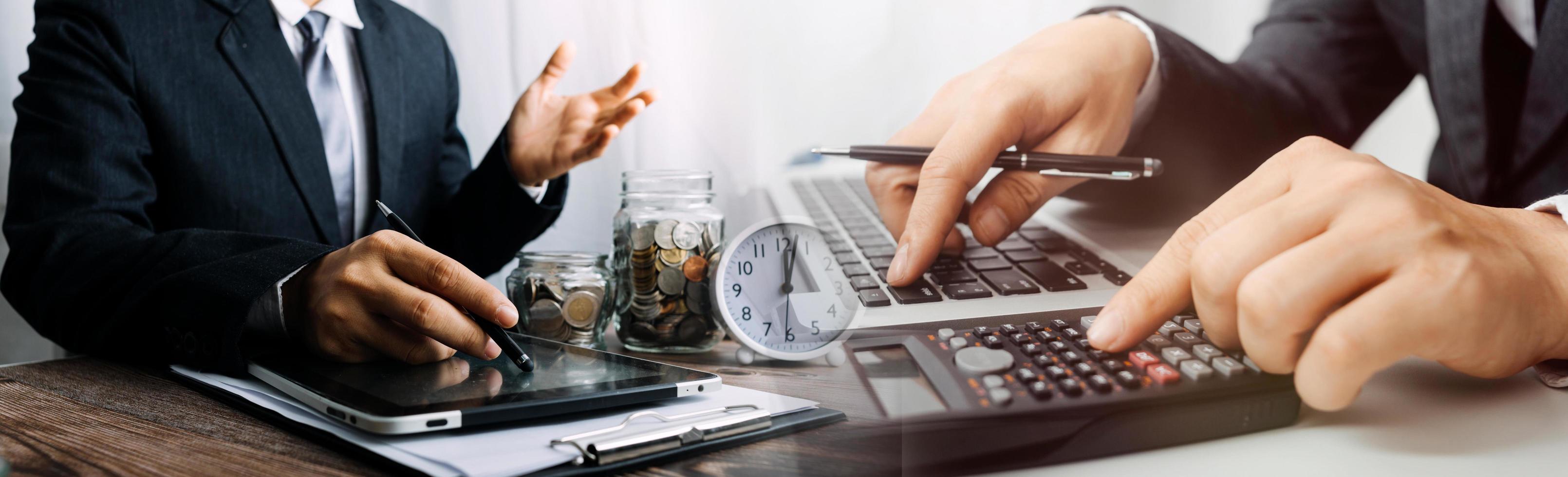 Business accounting concept, Business man using calculator with computer laptop, budget and loan paper in office. photo