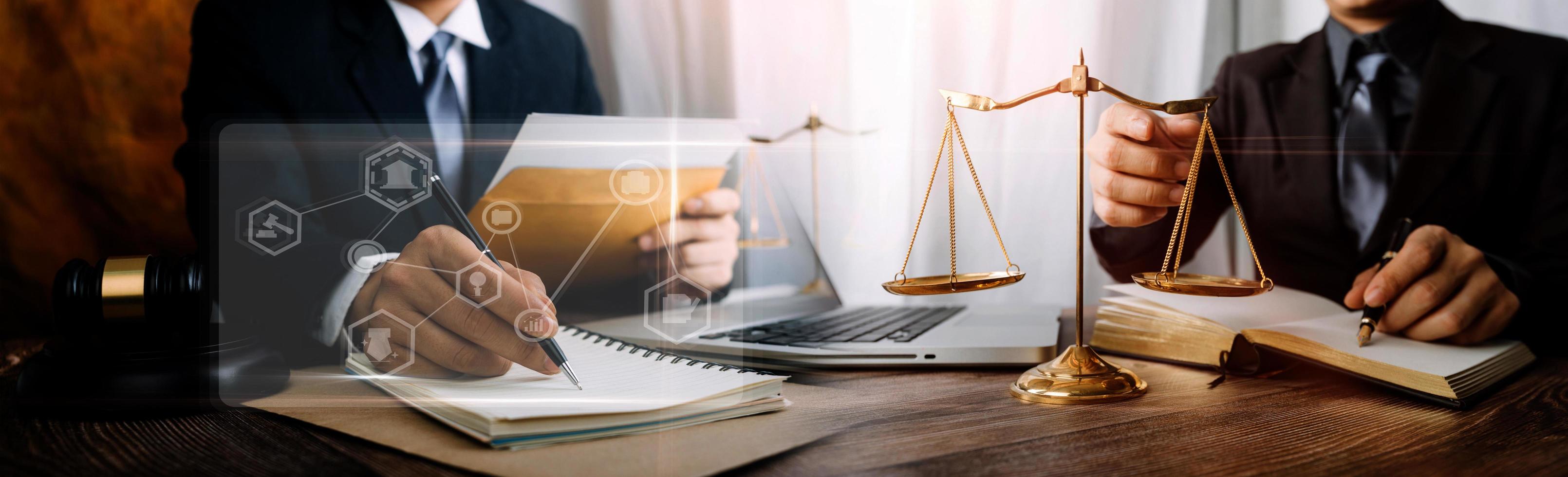 Business and lawyers discussing contract papers with brass scale on desk in office. Law, legal services, advice, justice and law concept picture with film grain effect photo