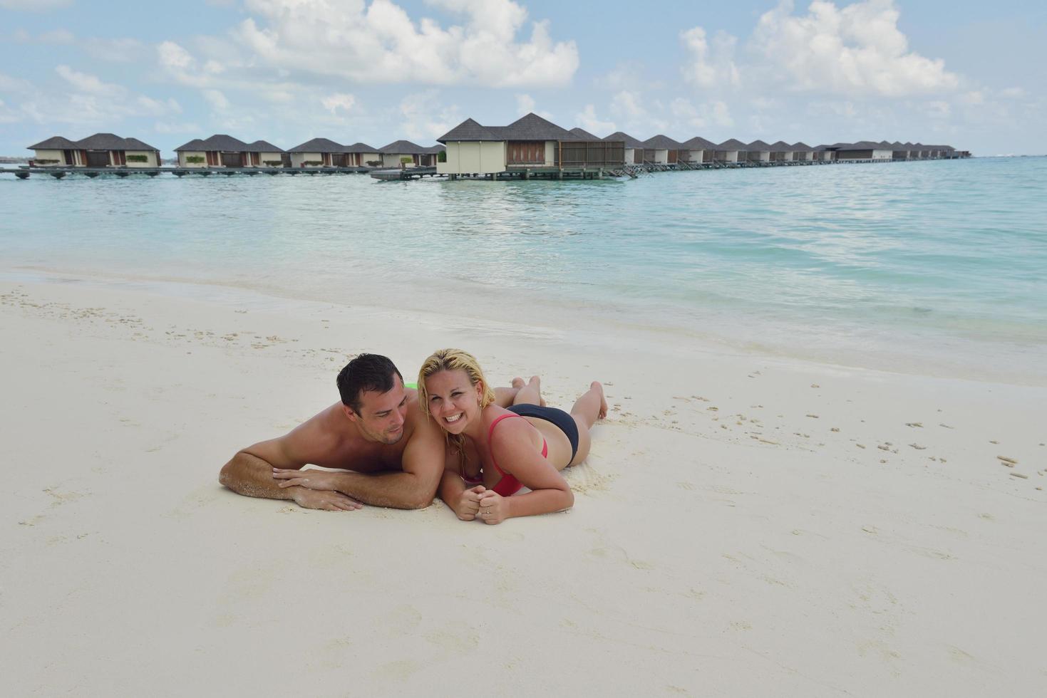 happy young  couple at summer vacation have fun and relax at beach photo