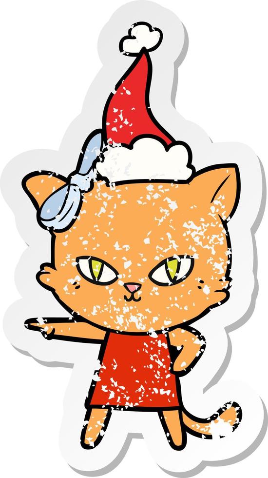 cute distressed sticker cartoon of a cat wearing dress wearing santa hat vector