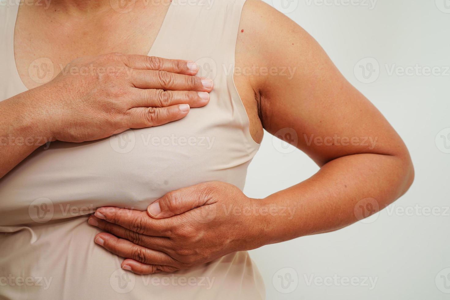 Asian woman self touching check lump or Breast cancer, Breast Self Exam. photo