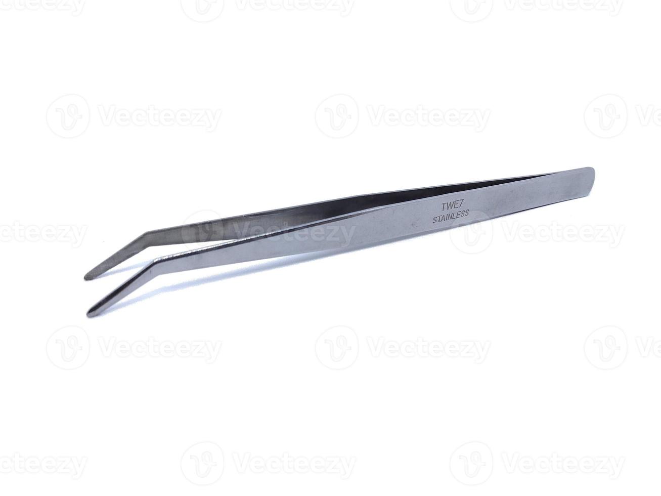 a tweezers on a white background photo