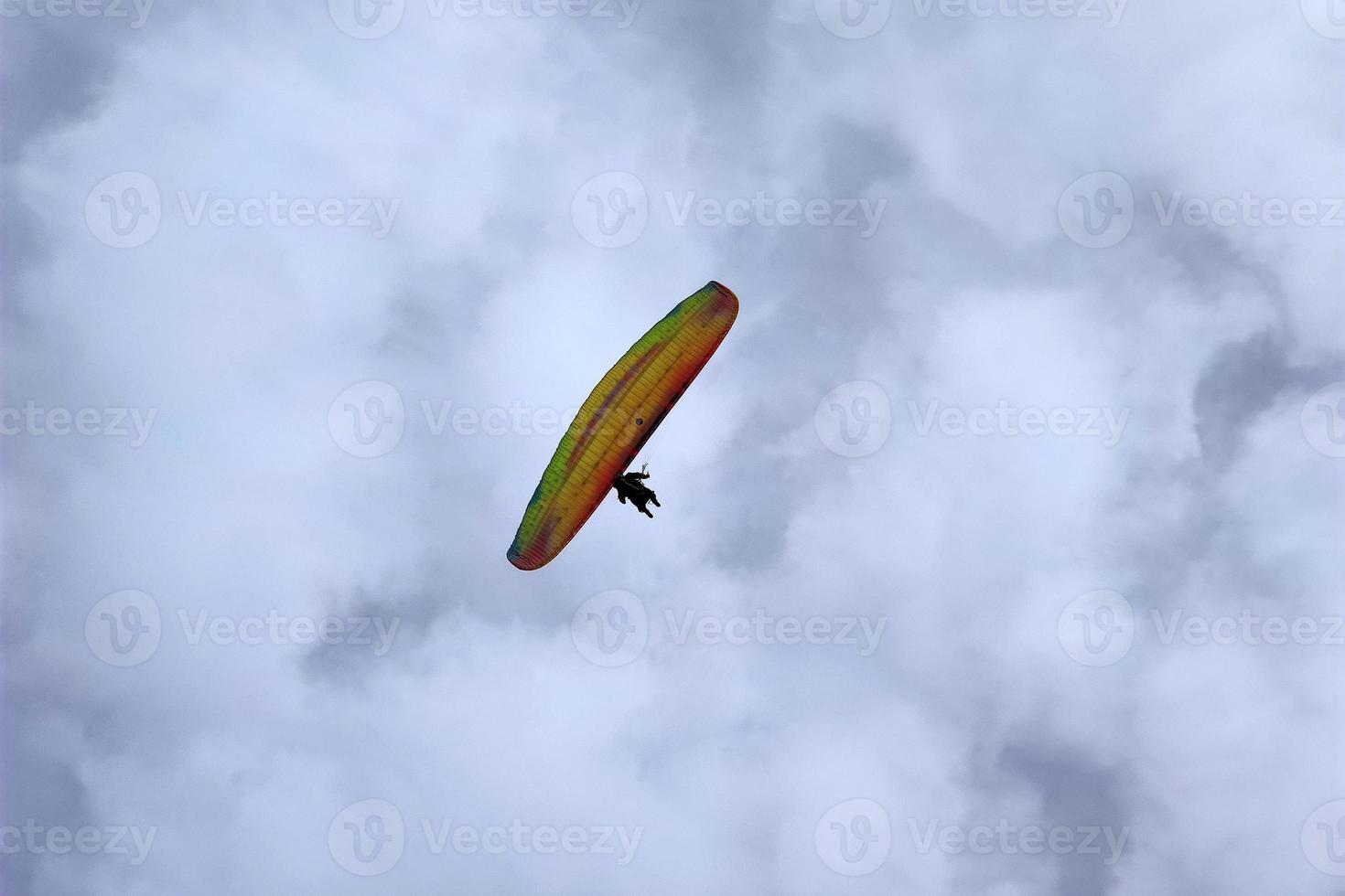 paraglider on cloudy sky photo