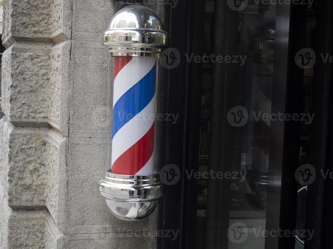 barber shop sign red white and blue photo