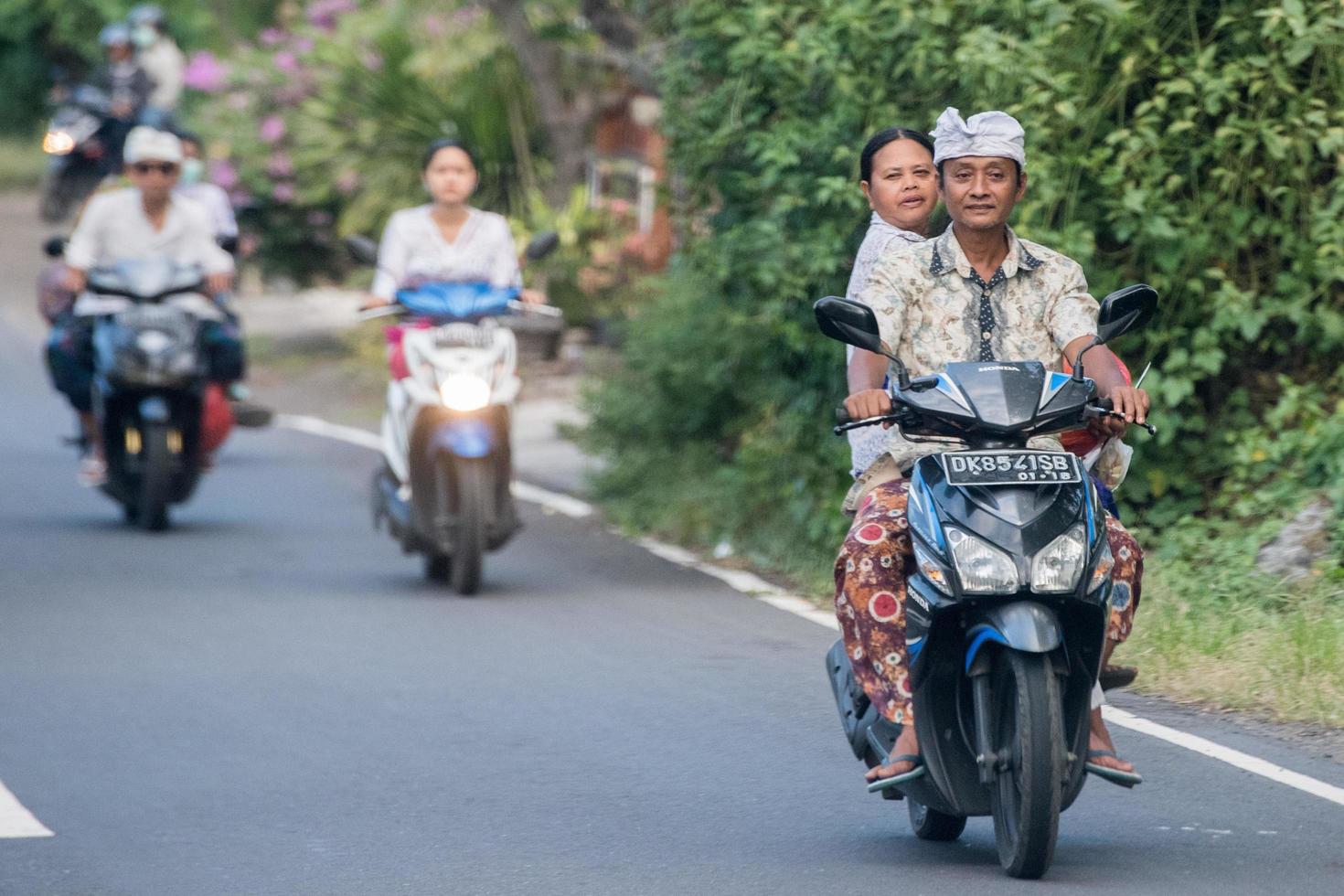 DENPASAR, BALI, INDONESIA - AUGUST 15, 2016 - Indonesia people biking photo