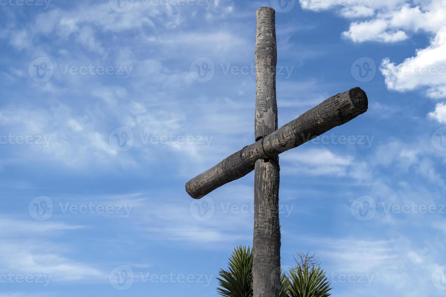 wood cross on sky background photo