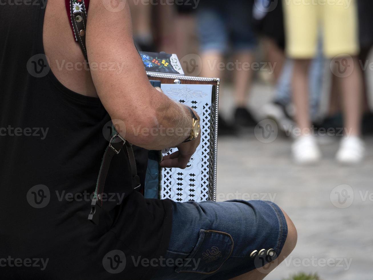 Hands playing accordion detail photo