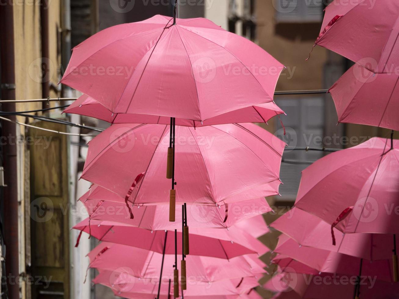 Grasse France pink umbrellas street photo