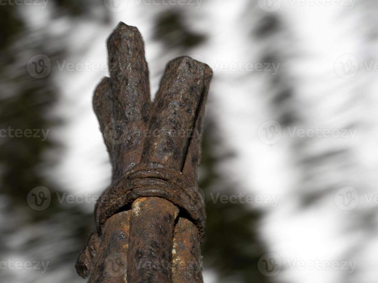 rusted iron bars crossed and tied up photo