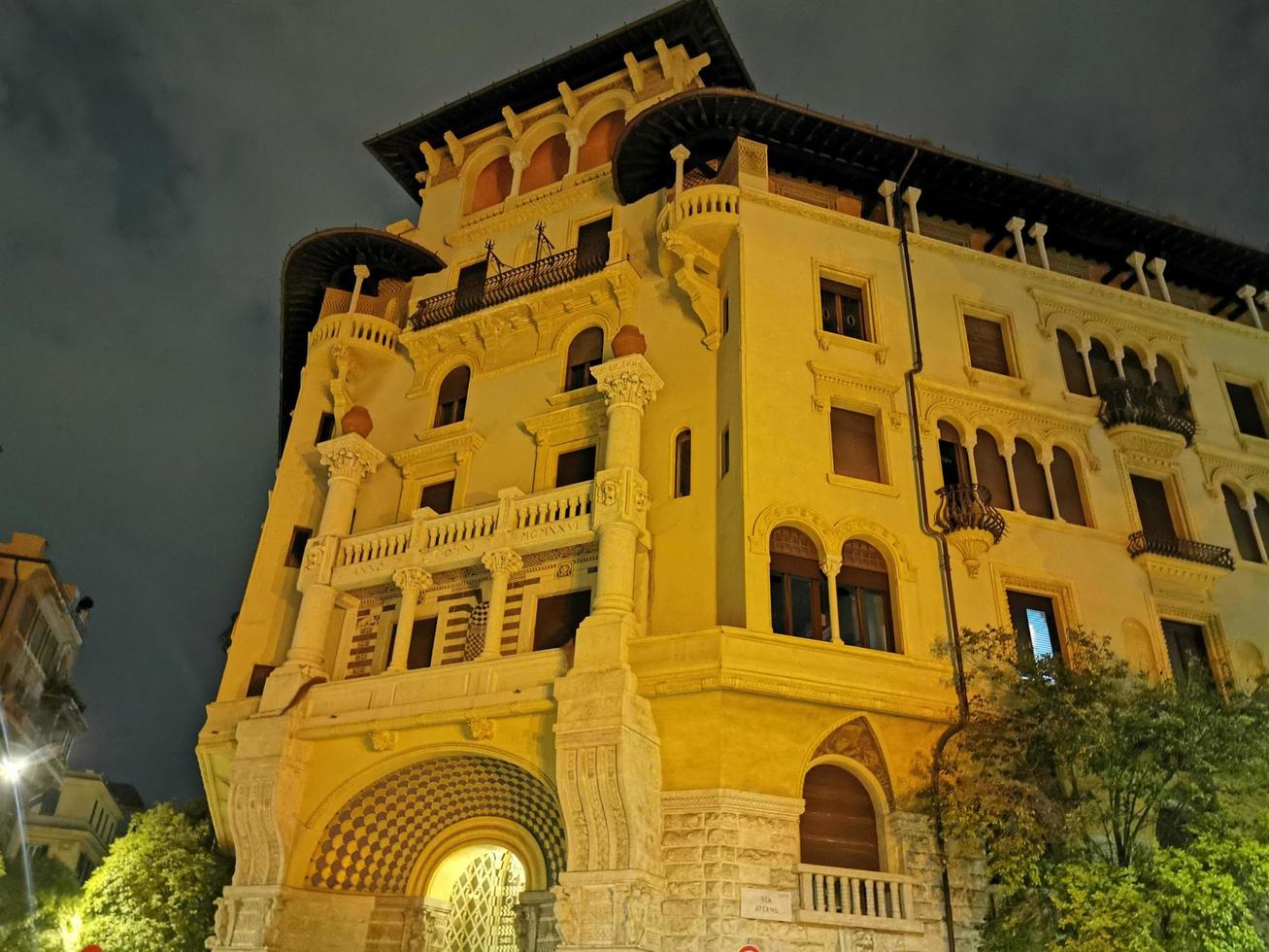 ROME, ITALY - JUNE 14 2019 - Coppede unusual style architechture district in roma buildings at night art nouveau liberty photo