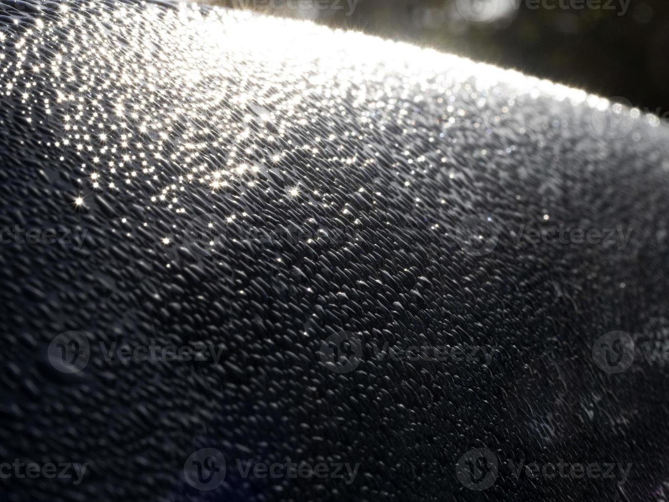 dew water drops on blue metallic surface photo