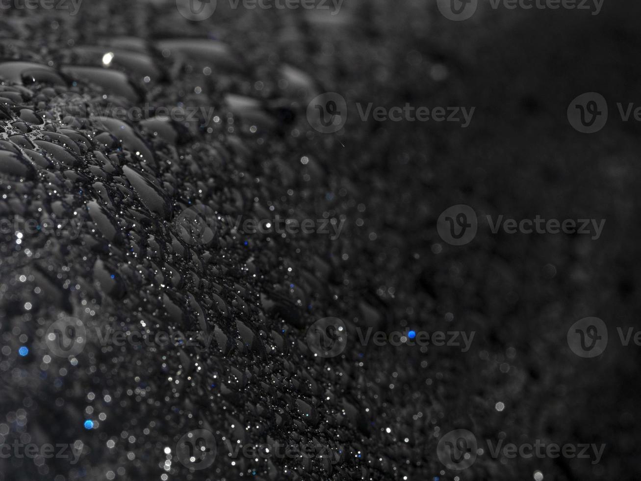 rain drops on blue metal close up macro photo