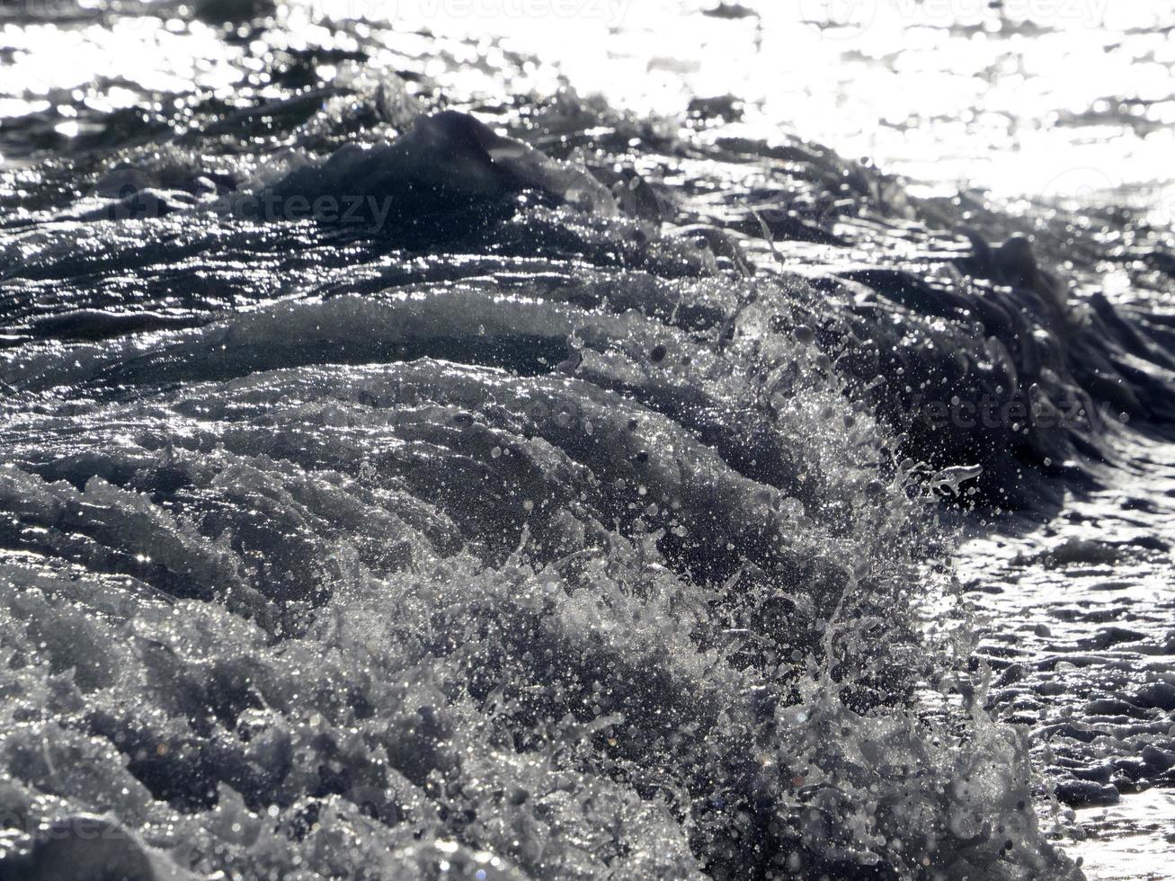 Sea wave on the shore photo