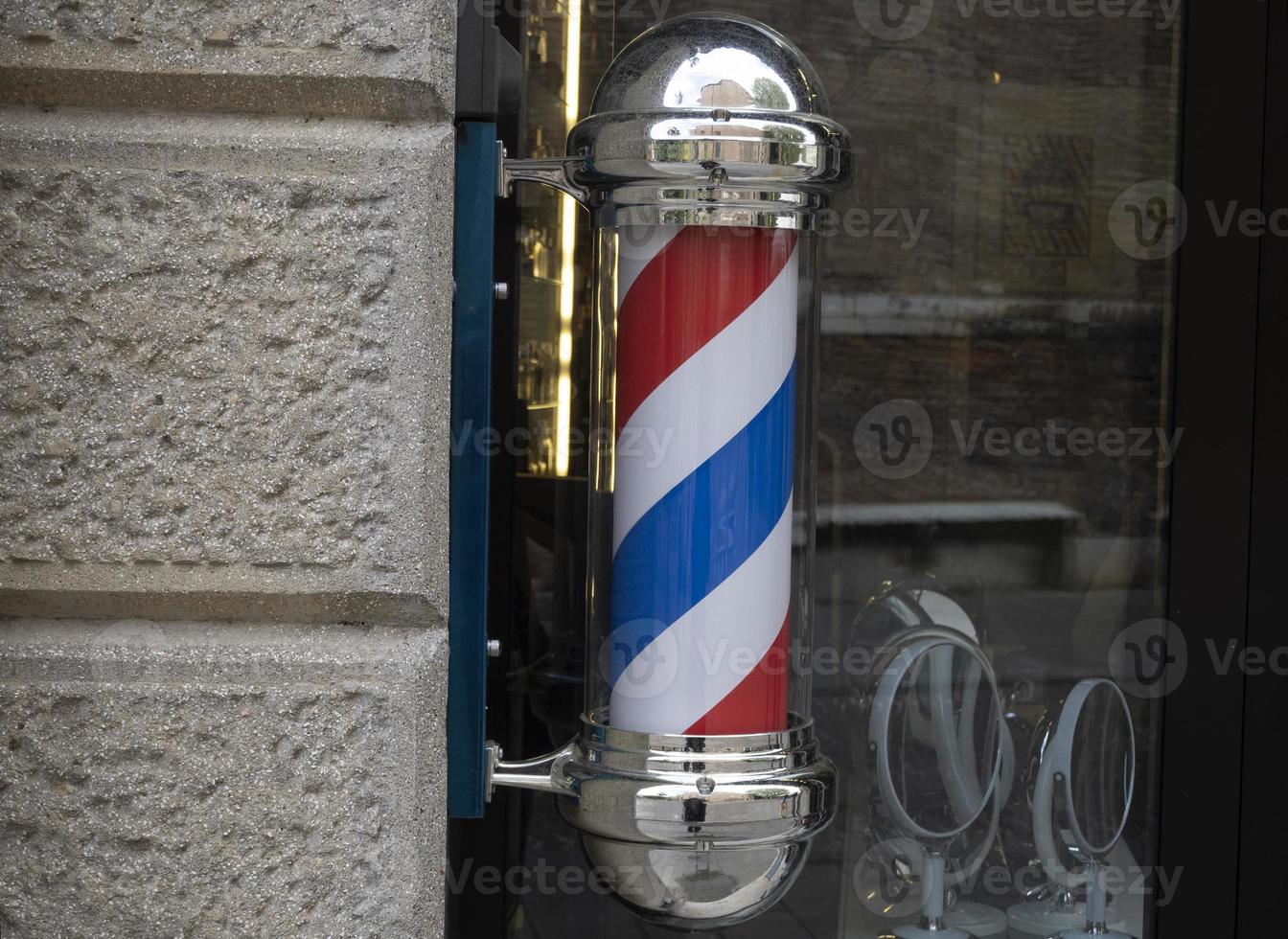 barber shop sign red white and blue photo