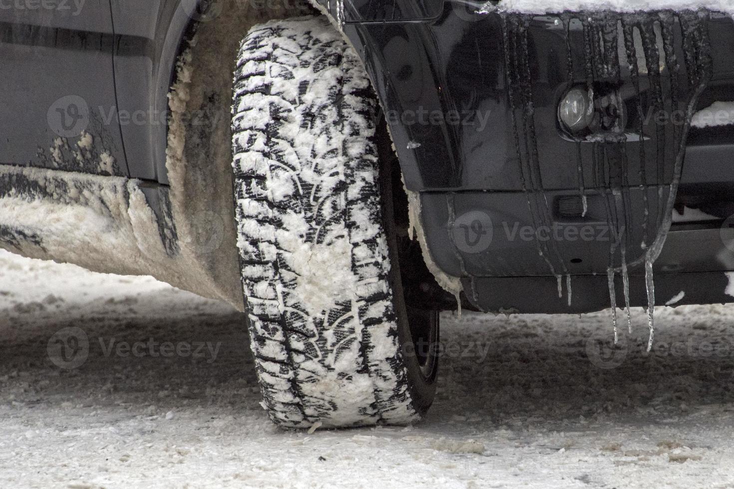 winter snow tire of car detail photo
